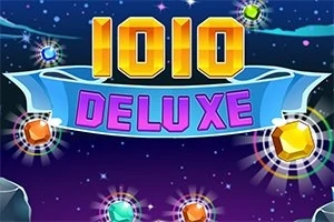 Hlavný nápis „1010 DELUXE“ na farebnom pozadí s rôznymi farebnými drahokamami okolo