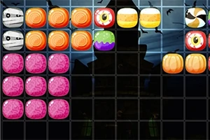 Farebná mriežka, kde sú rôzne sladkosti a predmety s halloweenskou tematikou zoradené vedľa seba