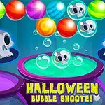 Farebné bubliny a lebky na tmavom pozadí s nápisom Halloween Bubble Shooter