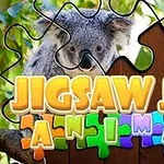 Puzzle dieliky prekryté obrazom koaly s farebným nápisom Jigsaw Jam Animal v popredí