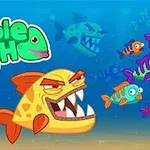 Žralokovitá ryba s ostrými zubami pláva medzi mnohými farebnými rybkami na morskom dne, s logom nimble FISH v ľavej časti obrázka