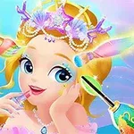 Dievčatko s blond vlasmi a korunkou z morských mušlí si aplikuje make-up, zatiaľ čo krab drží štetec v pastelových farbách