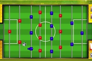 Stolný futbal na obrazovke s pákami a červenými a modrými hráčmi na zelenom ihrisku